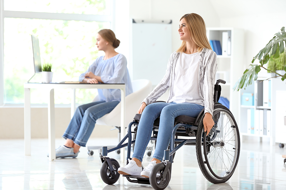 Beautiful handicapped woman in office