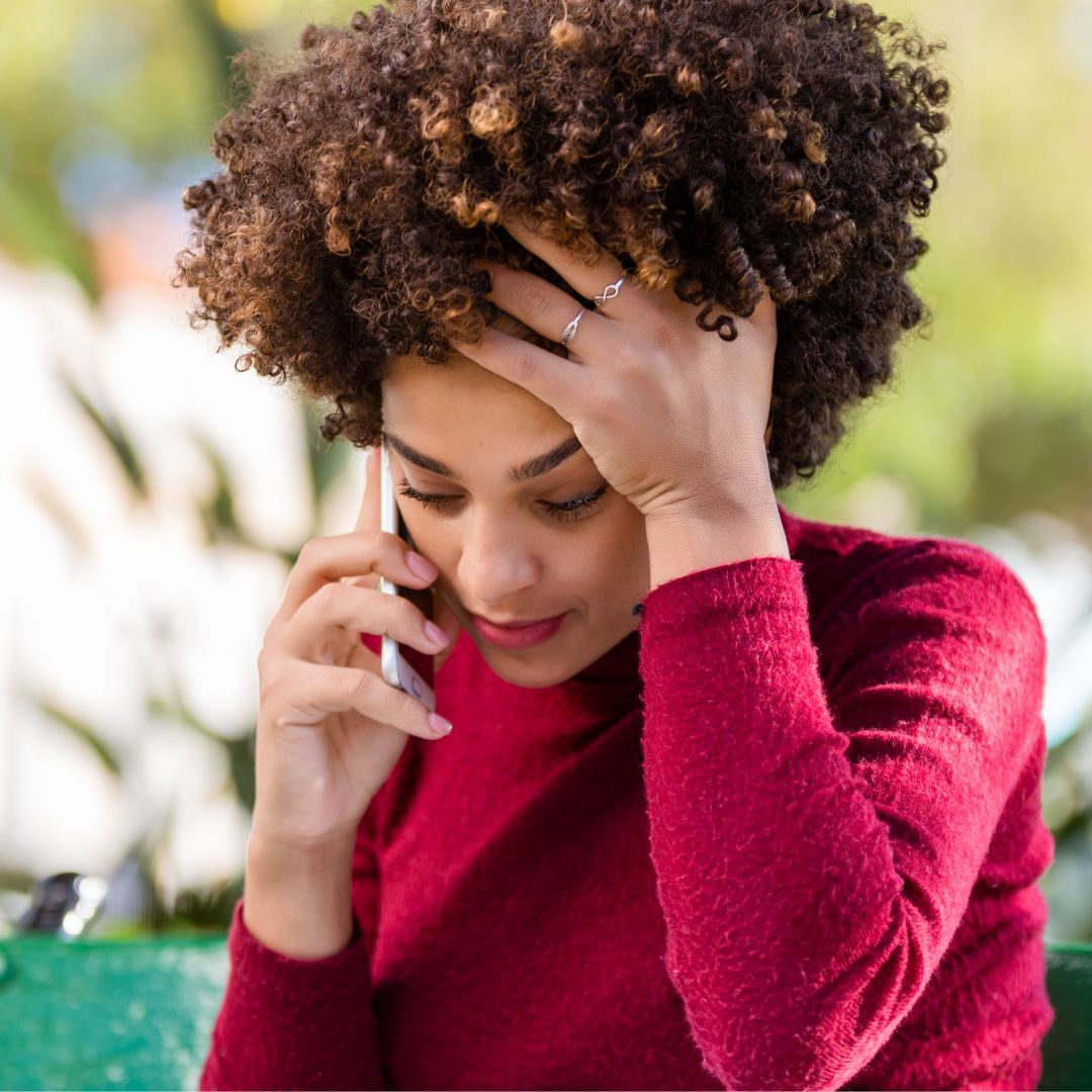 frustrated woman making phone call