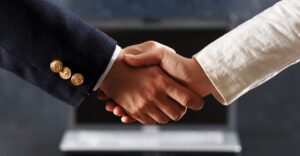 people shaking hands in