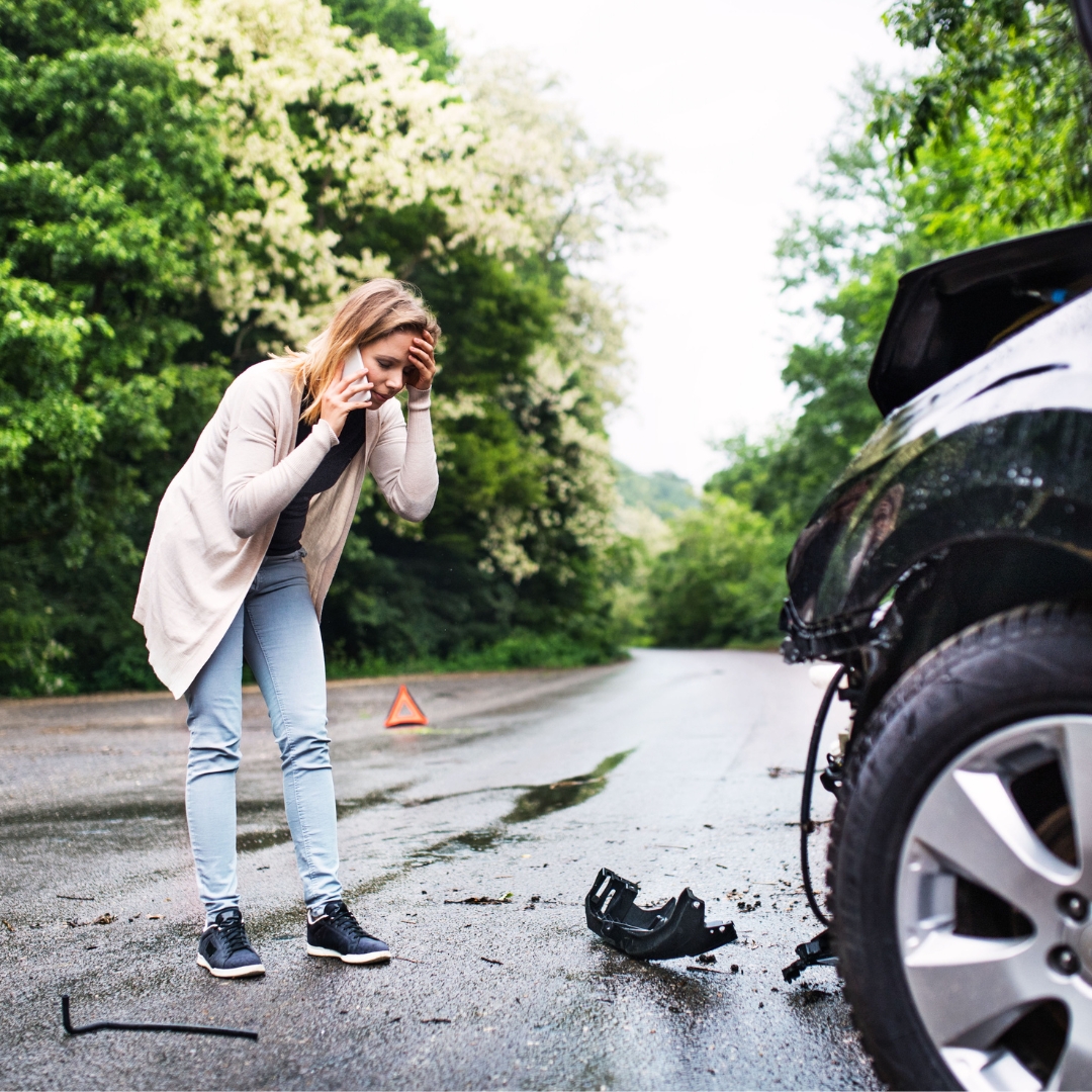 Woman on the phone with her lawyer after an accident