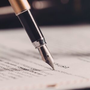 a piece of paper with a pen