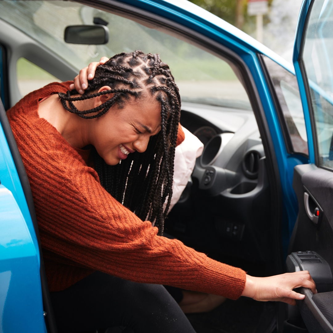 Woman with neck pain after car accident