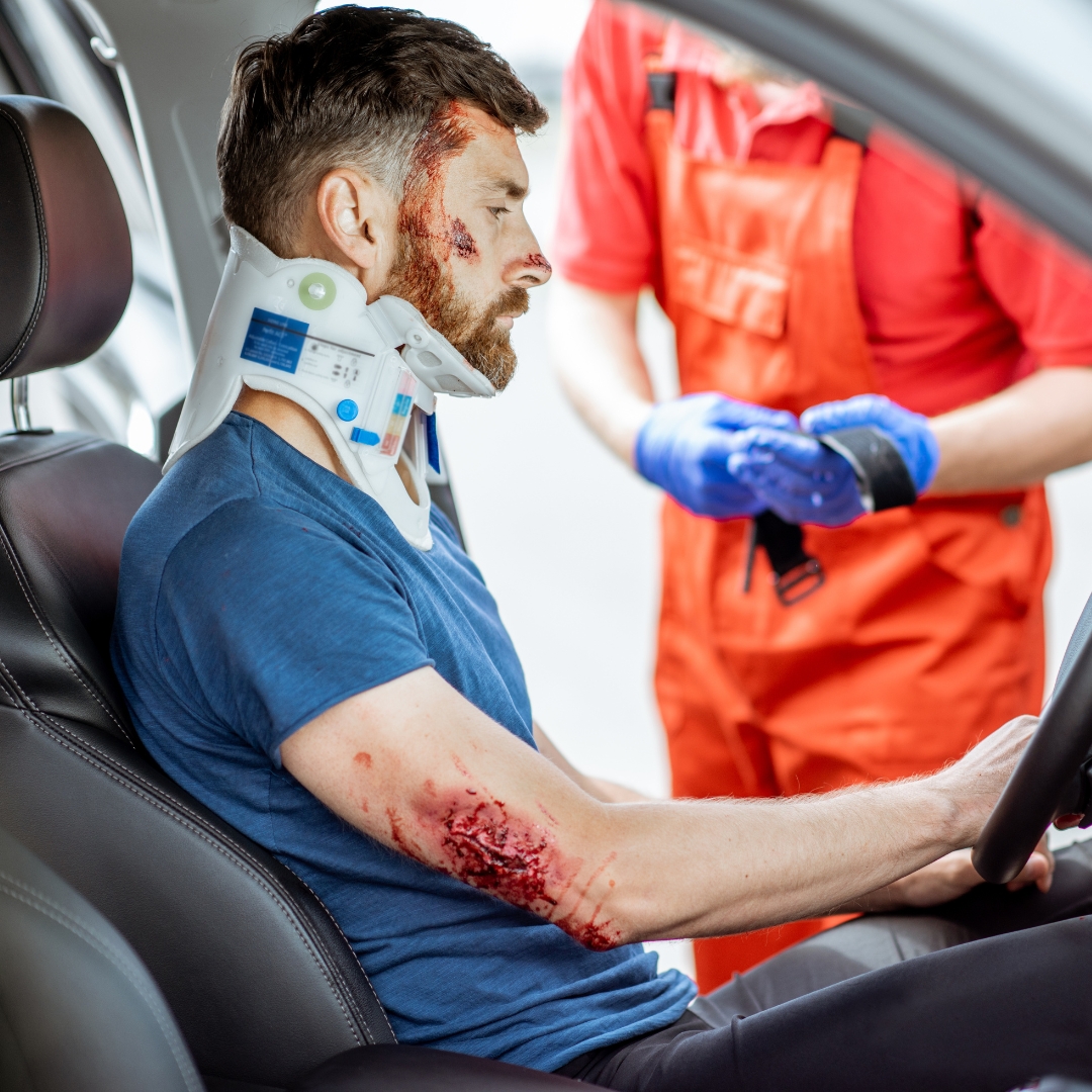 Man receiving medical care for his injuries