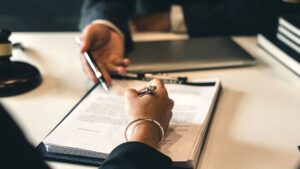 A woman taking notes while speaking to a judge
