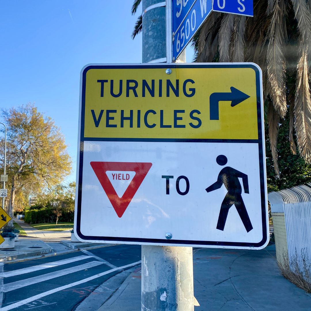 yield to pedestrians sign