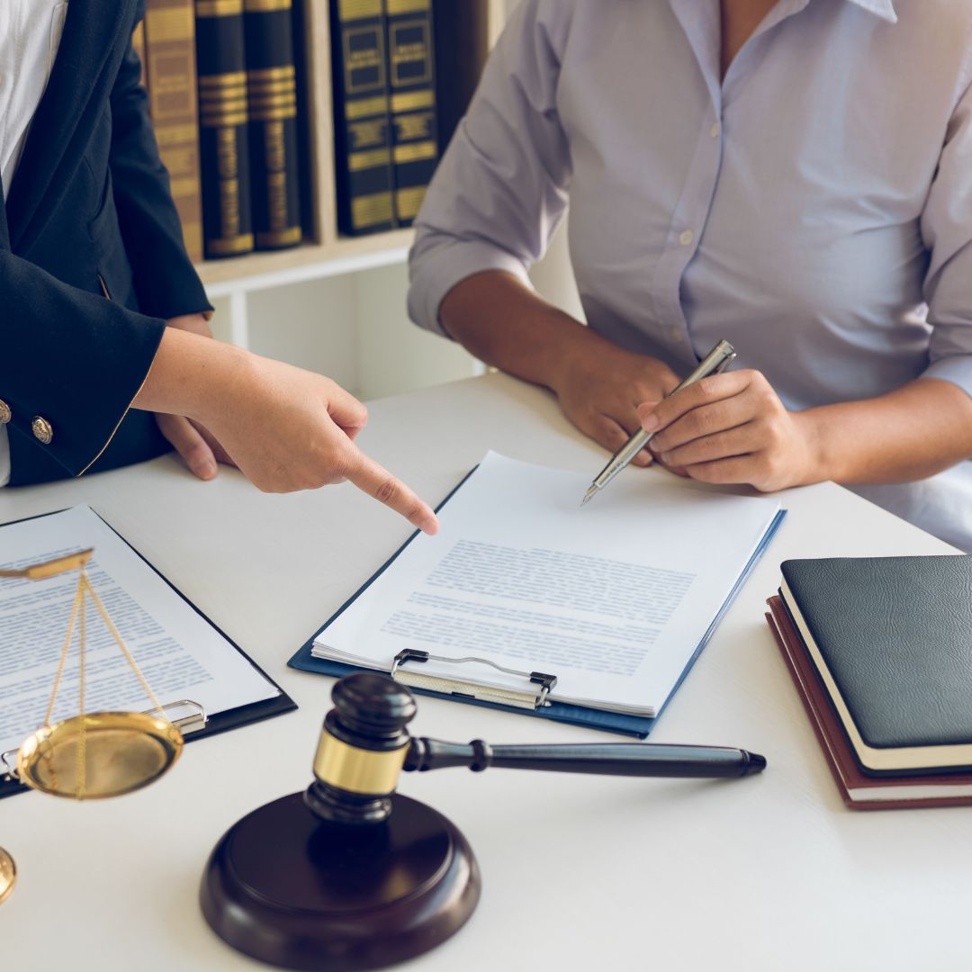 two people looking at a document