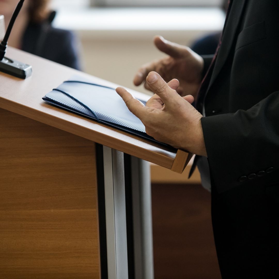 Someone standing at a court stand
