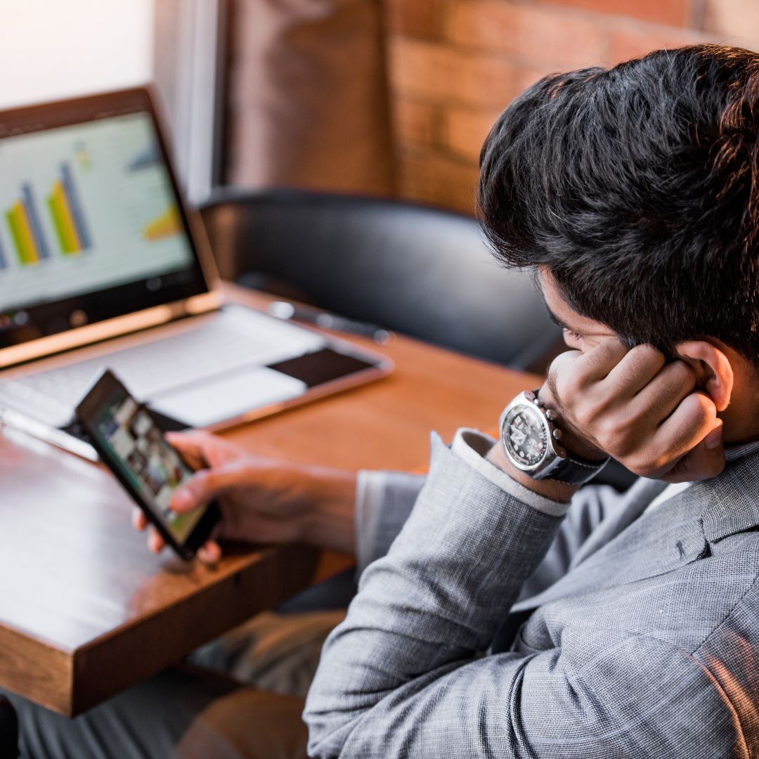 Man on phone and computer