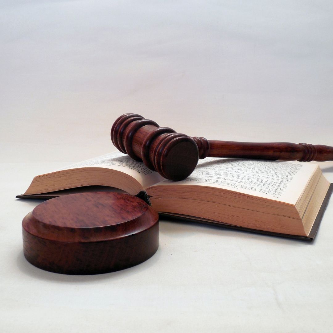 Judge mallet atop a law book