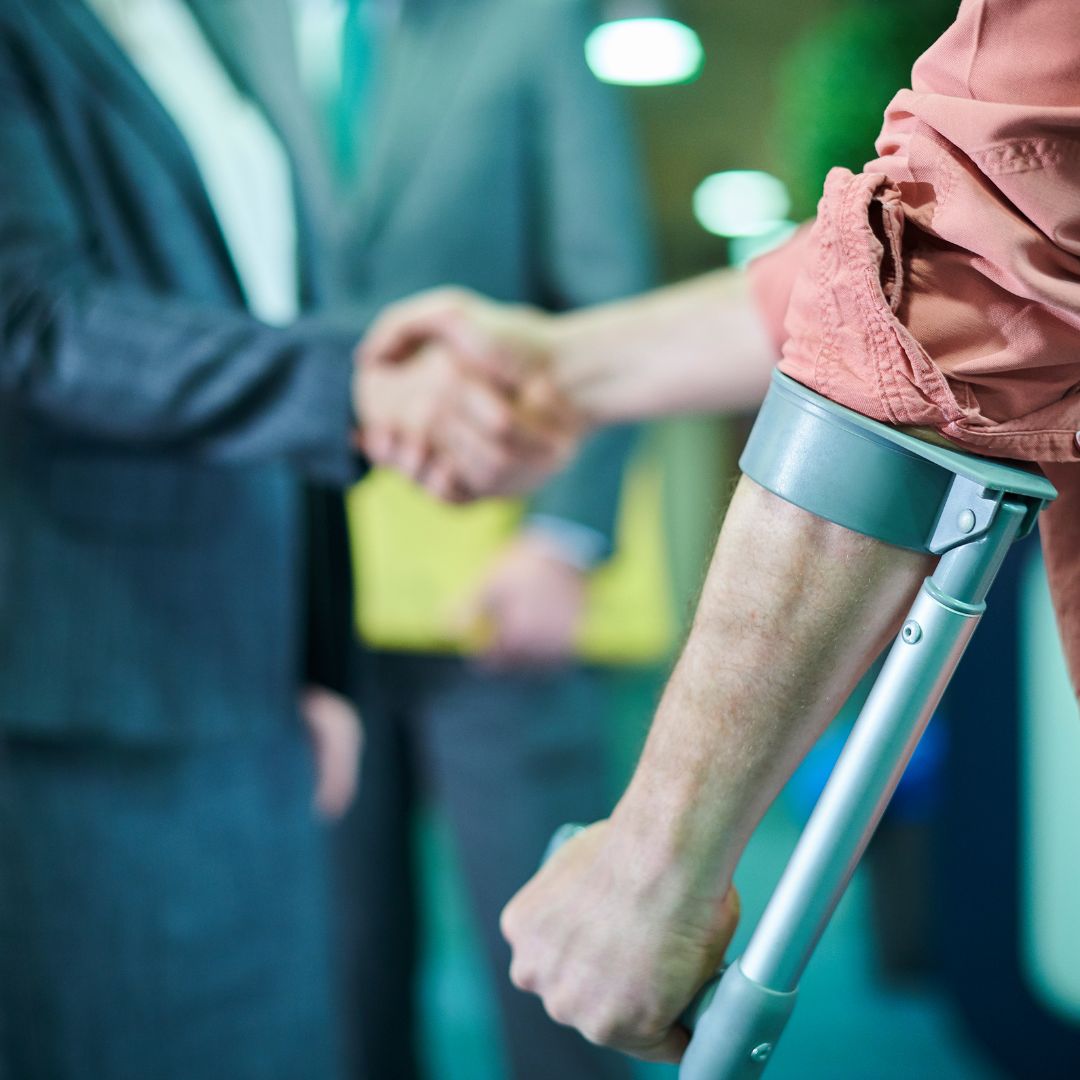 man shaking hands with lawyer