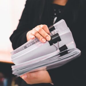 person holding paperwork