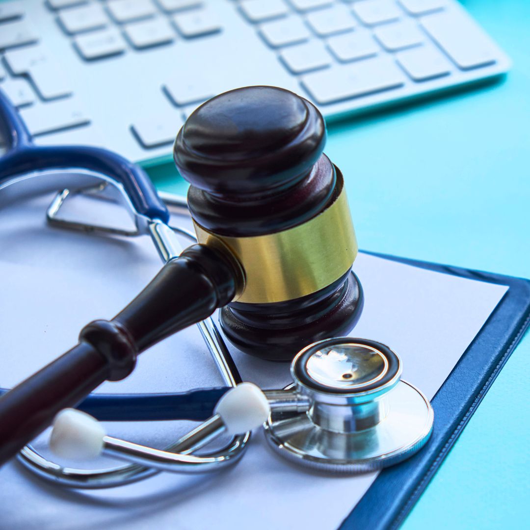 Judge gavel above medical tool