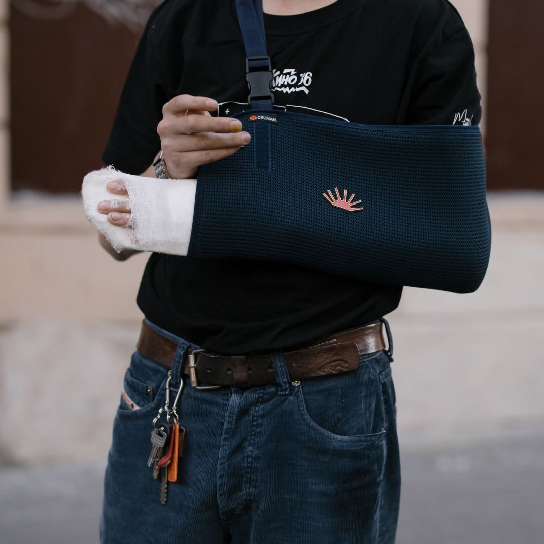 person with broken arm