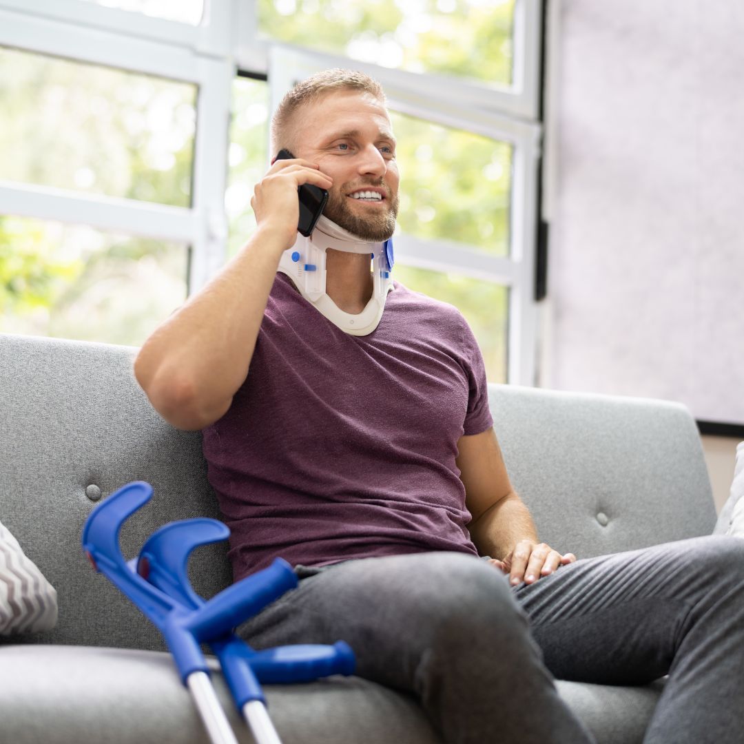 Man with a broken neck talking on the phone