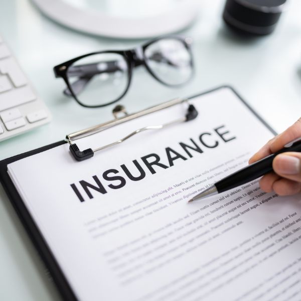 A paper with the words insurance on top