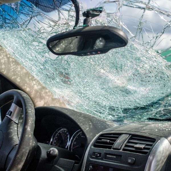 A car with a destroyed front window