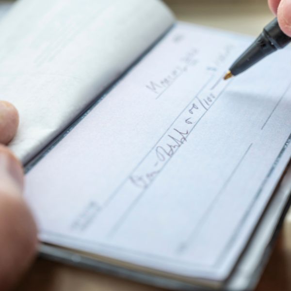 Someone writing a check