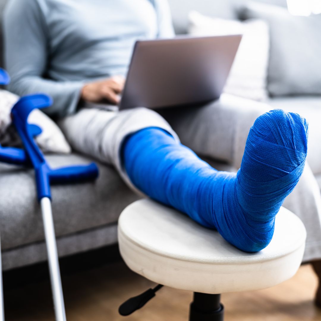 An injured person on their computer