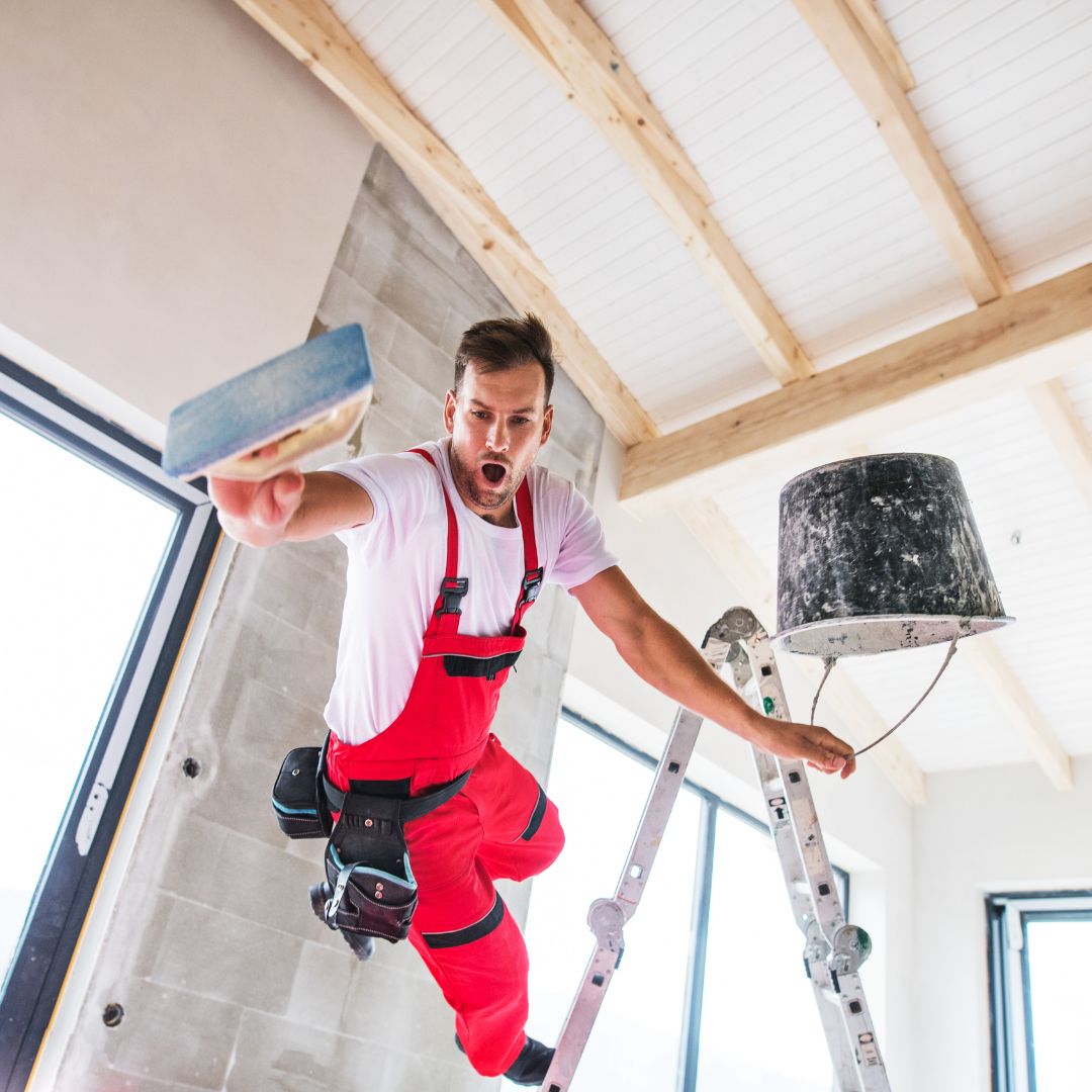 Worker falling off of ladder