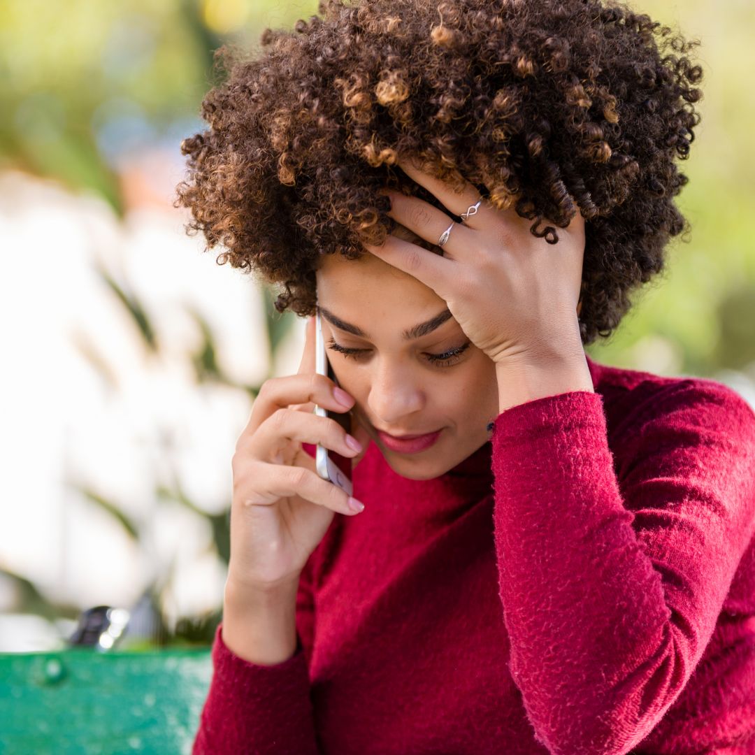 distressed woman on the phone