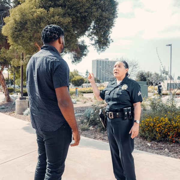 Man talking to a cop