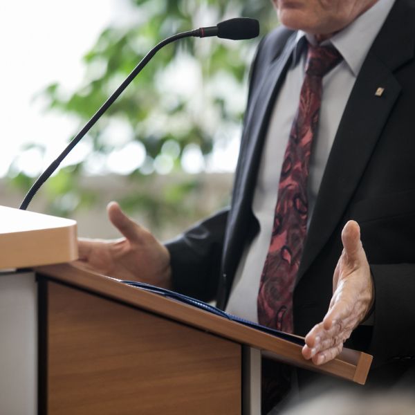 A person speaking at a podium