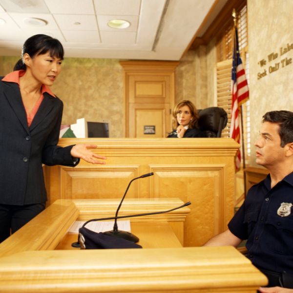 An attorney talking with a police officer