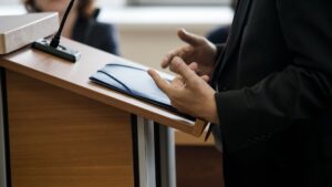 A person speaking at a podium