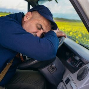 A man asleep at the wheel