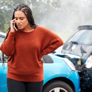 A women on a phone after a car crash