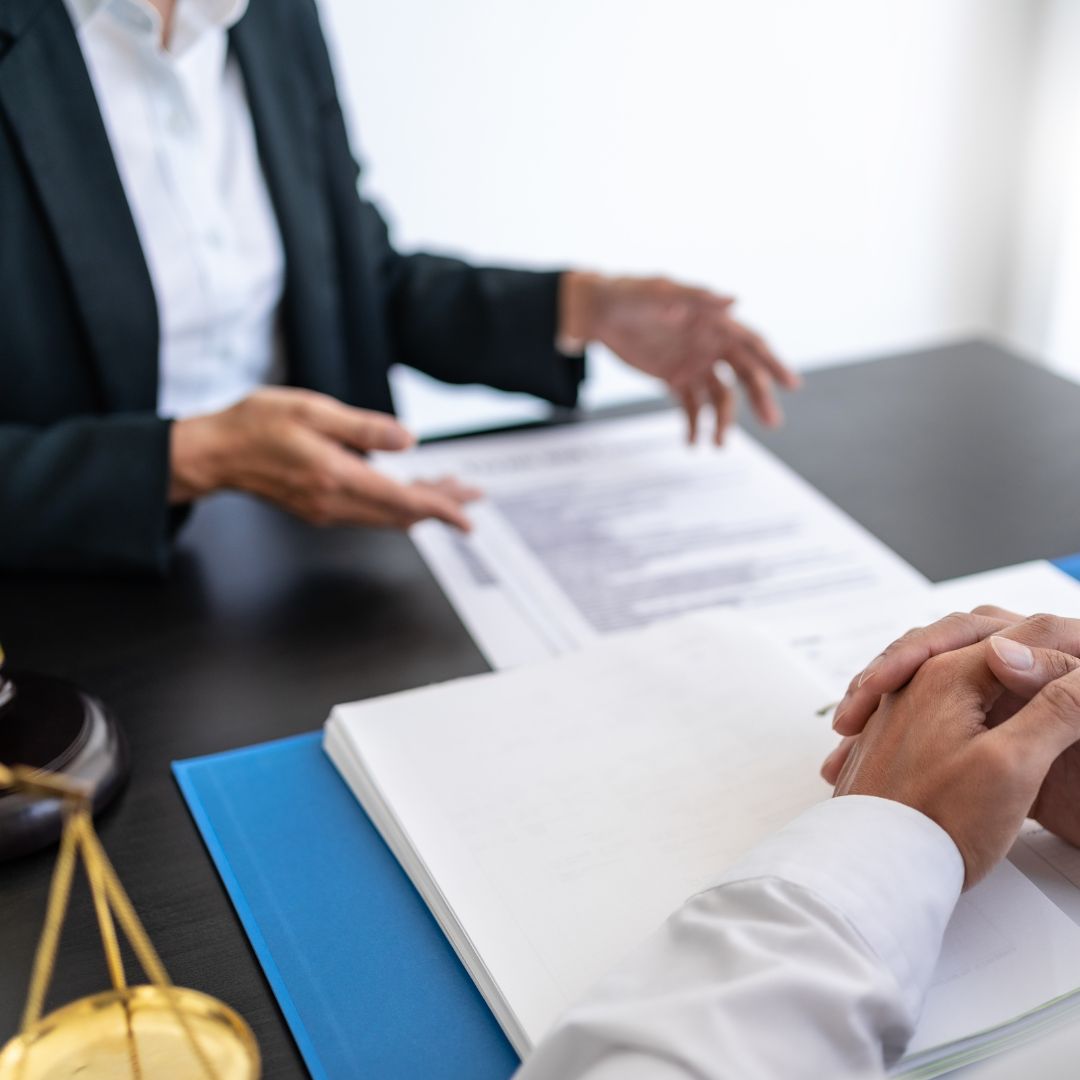 Lawyer going over legal documents with client