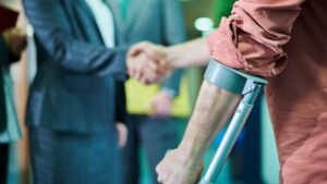 An injured man shaking hands with someone