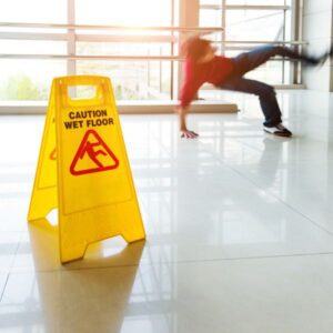 A person slipping on a wet floor