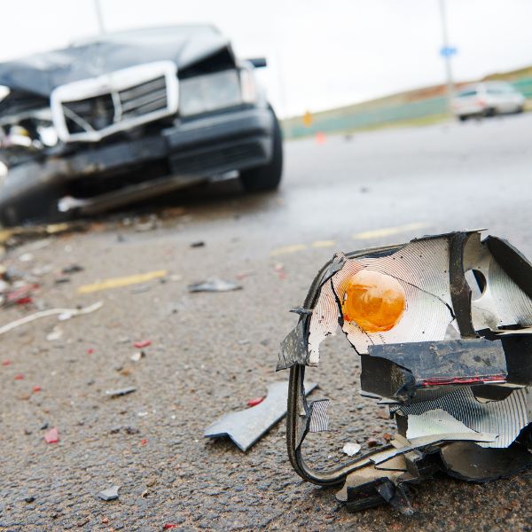 A cars side mirror on the floor after a crash