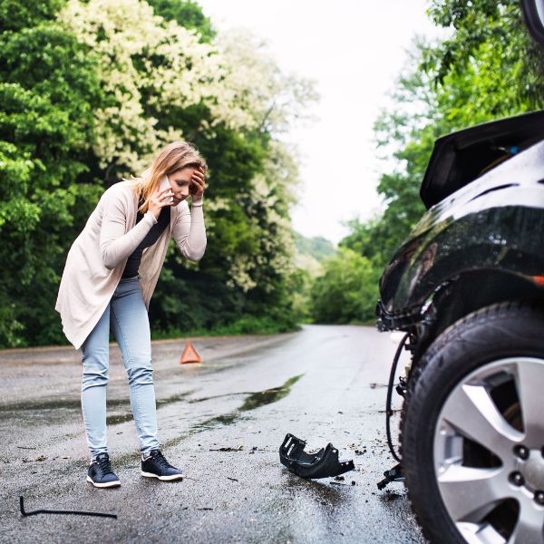 A women on the phone after a car crash