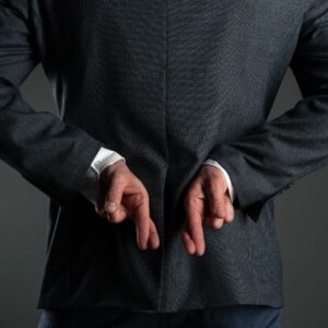 A person with crossed fingers behind their back