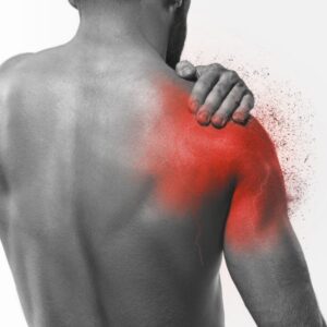 A person grabbing their shoulder in pain