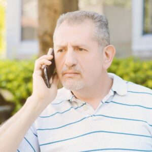 A frustrated man on a phone call