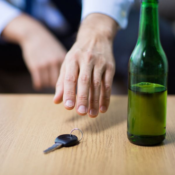A person who just drank a beer grabbing their keys