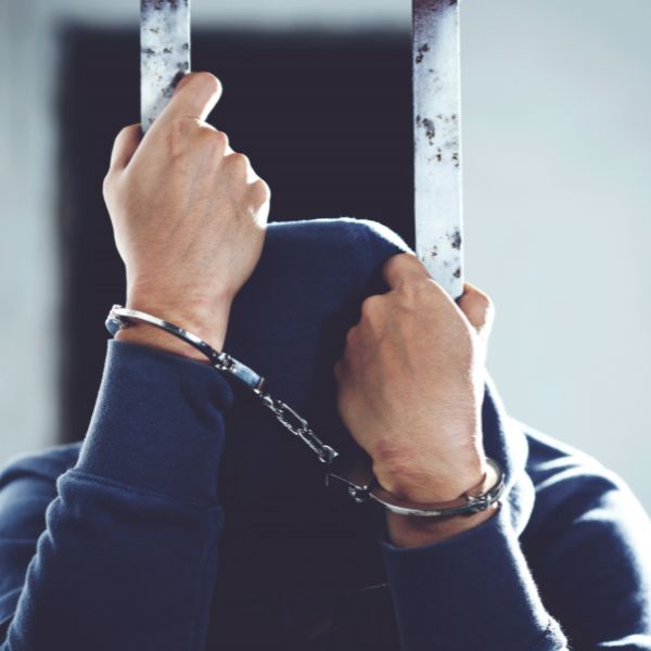 A person sad that is in jail+-