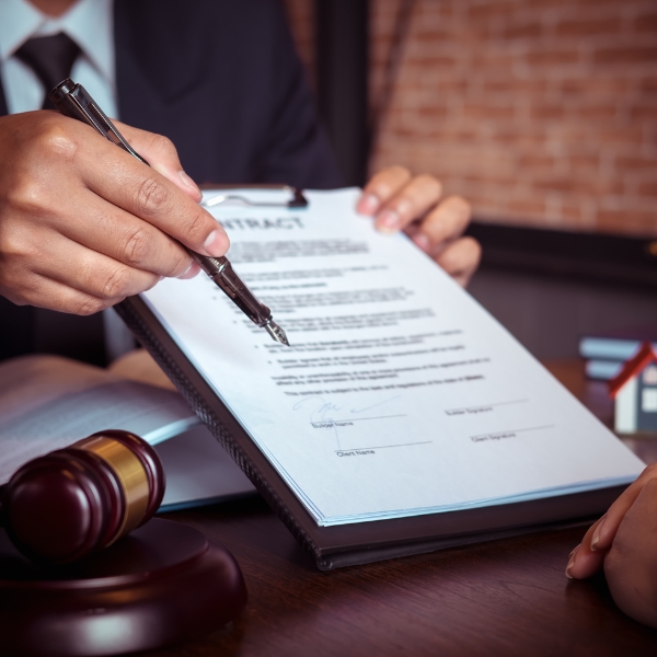 A lawyer pointing to something specific within a contract