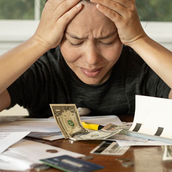 A women grabbing her head in frustration