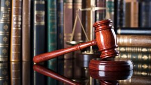 A judge gavel on top of books