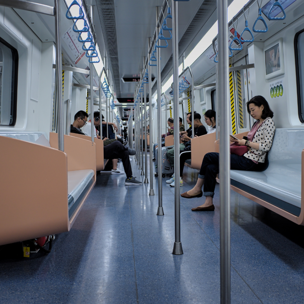 People sitting inside a subway