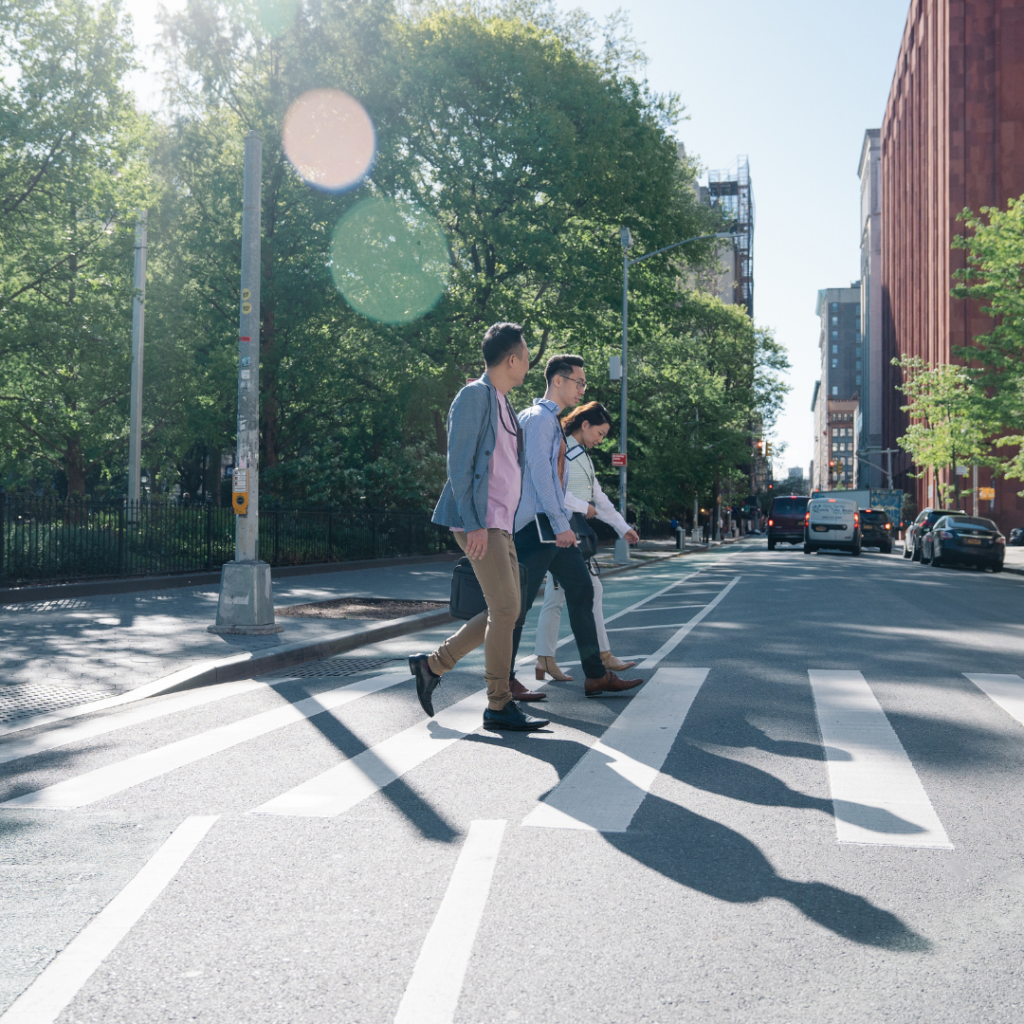 Two people using a crosswalk