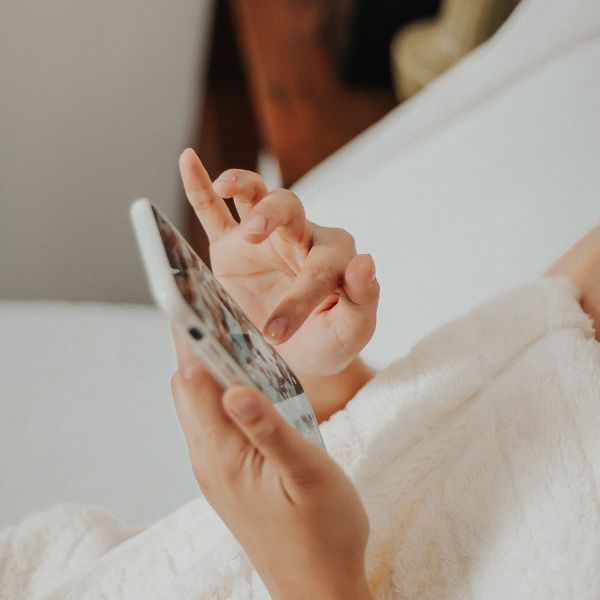 A woman scrolling on her phone