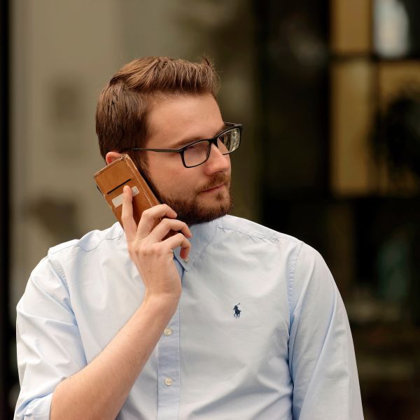 A man speaking on the phone