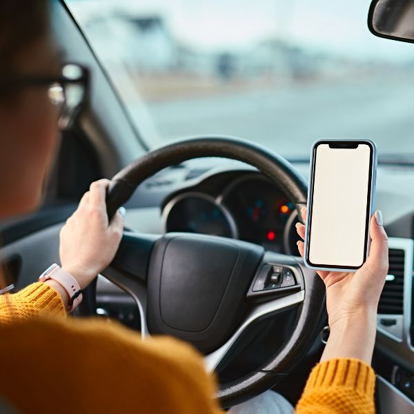 A women on the phone while driving