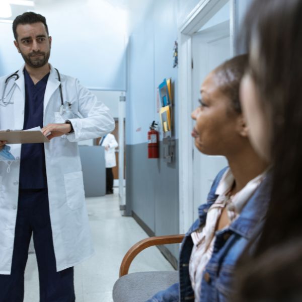 A doctor speaking to a patient