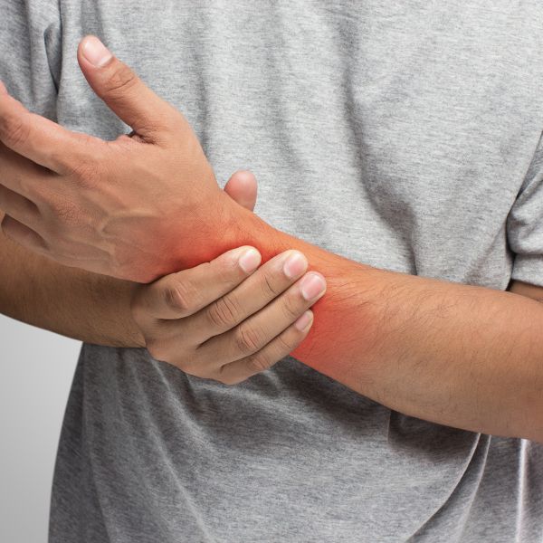 Man grabbing his wrist in pain